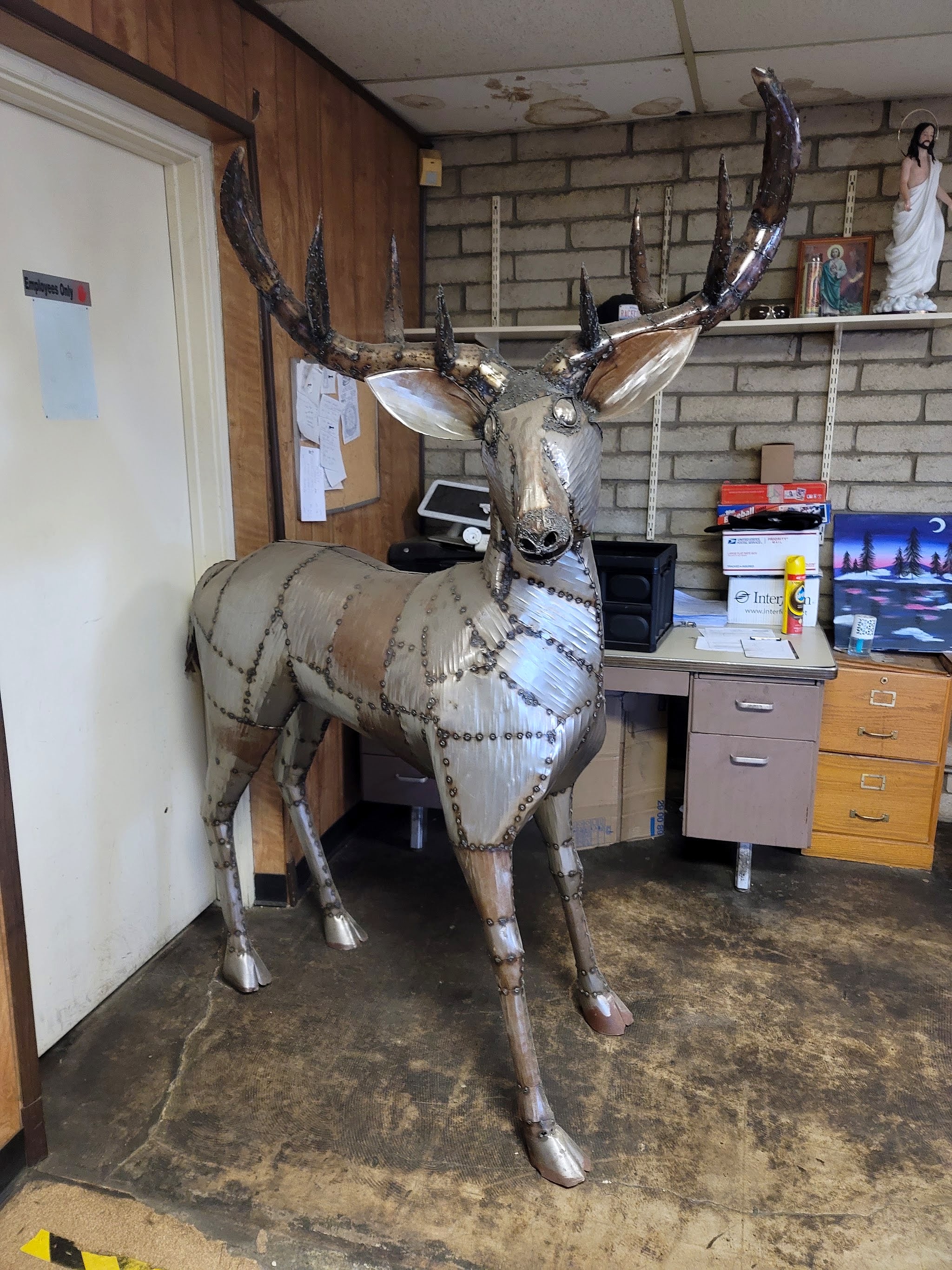 The steel deer sculpture in the shop office